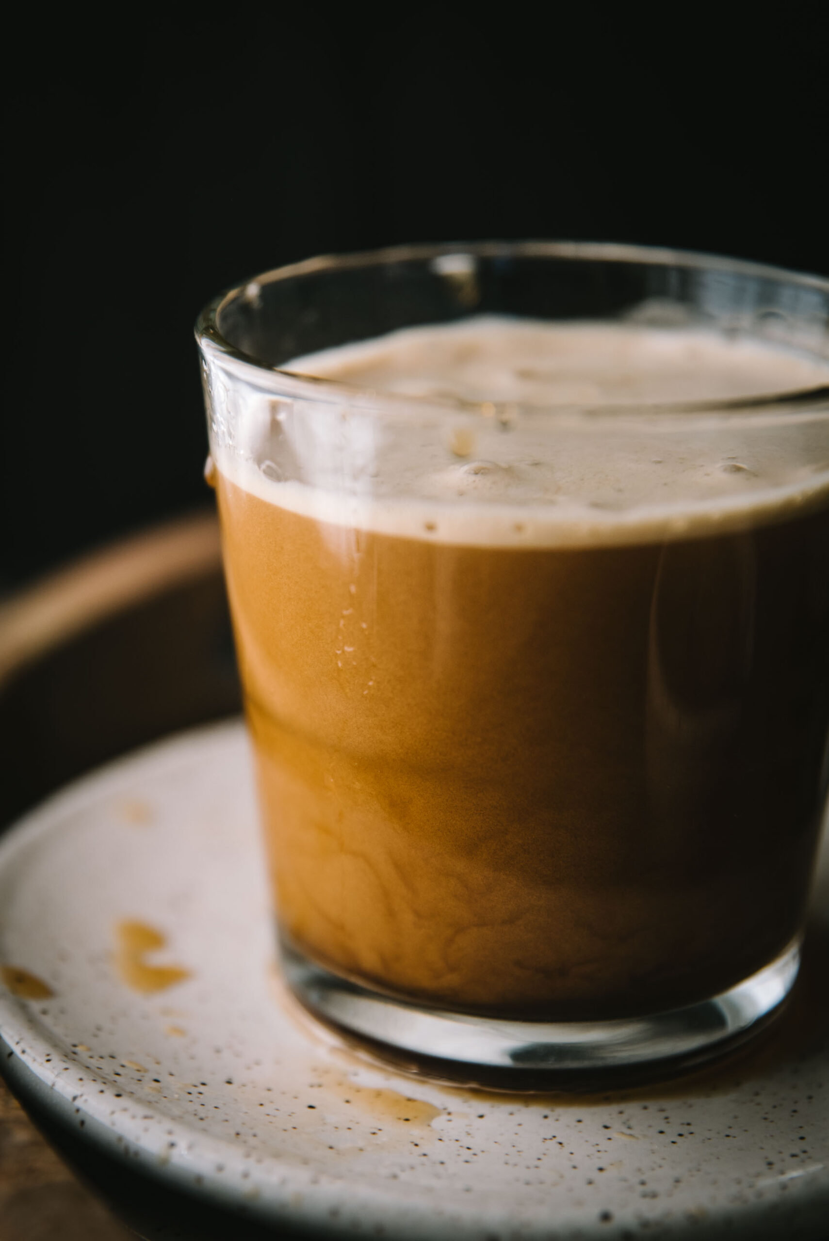 close up of nitro cold brew settling in a glass