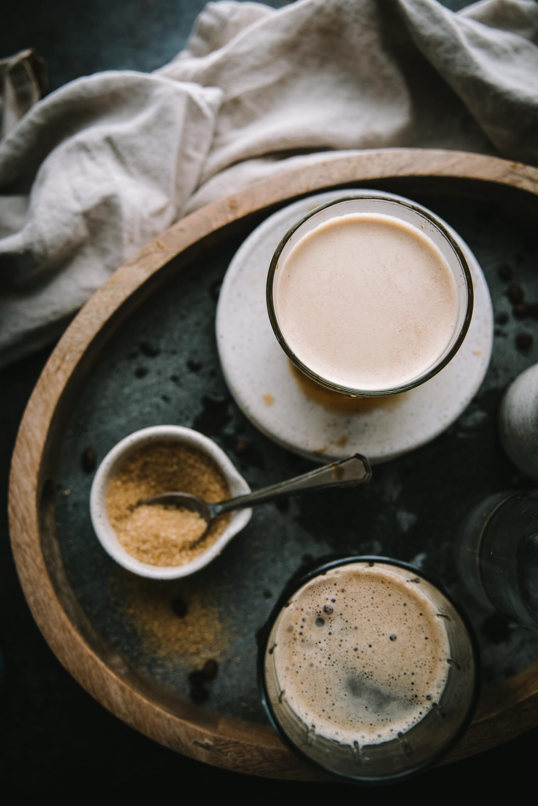 overhead of coffee in a glass on a tray