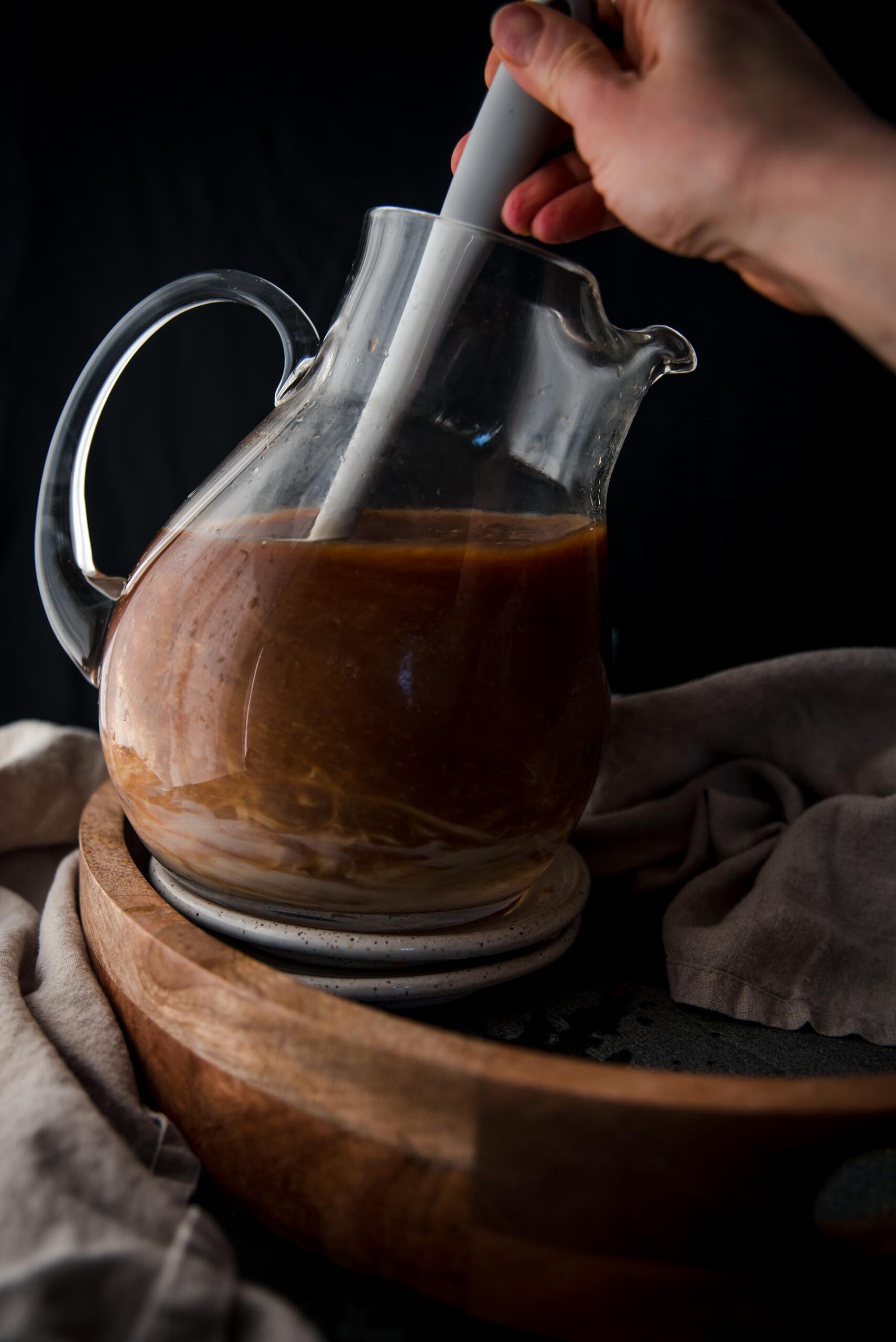 mixing sweetened condensed milk into coffee