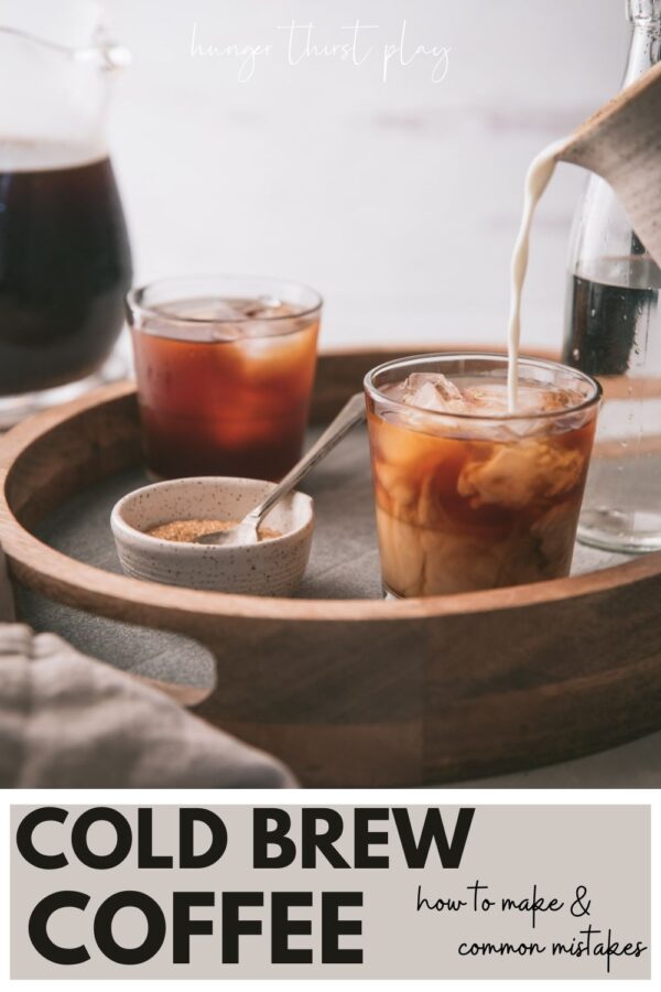 milk pouring into glasses of cold brew coffee