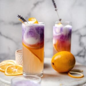 glasses layered with lemonade, sorbet, and empress gin