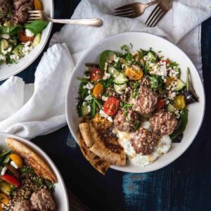 overhead photo of quinoa bowls with meatballs