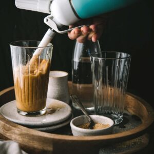 pouring nitro coffee into a glass