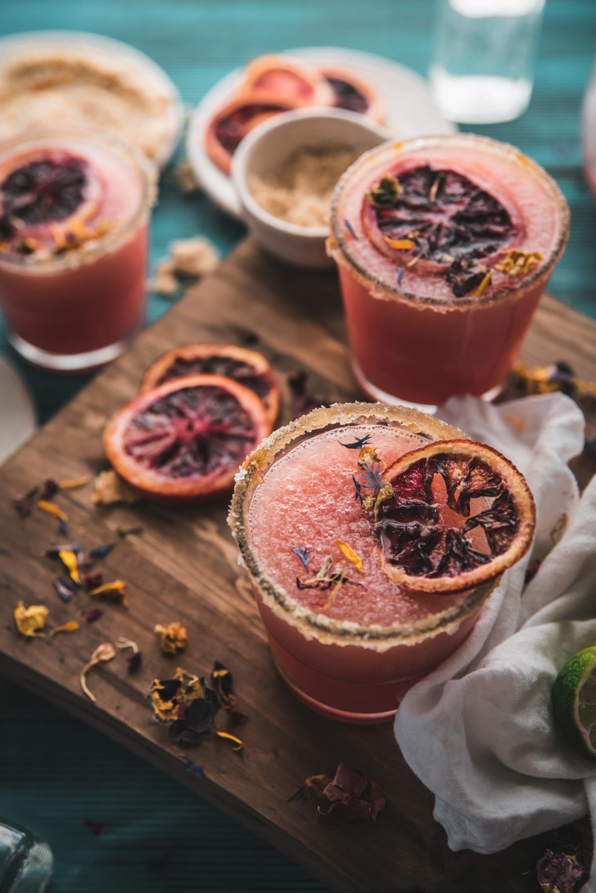 side angle of frozen drinks on a blue background