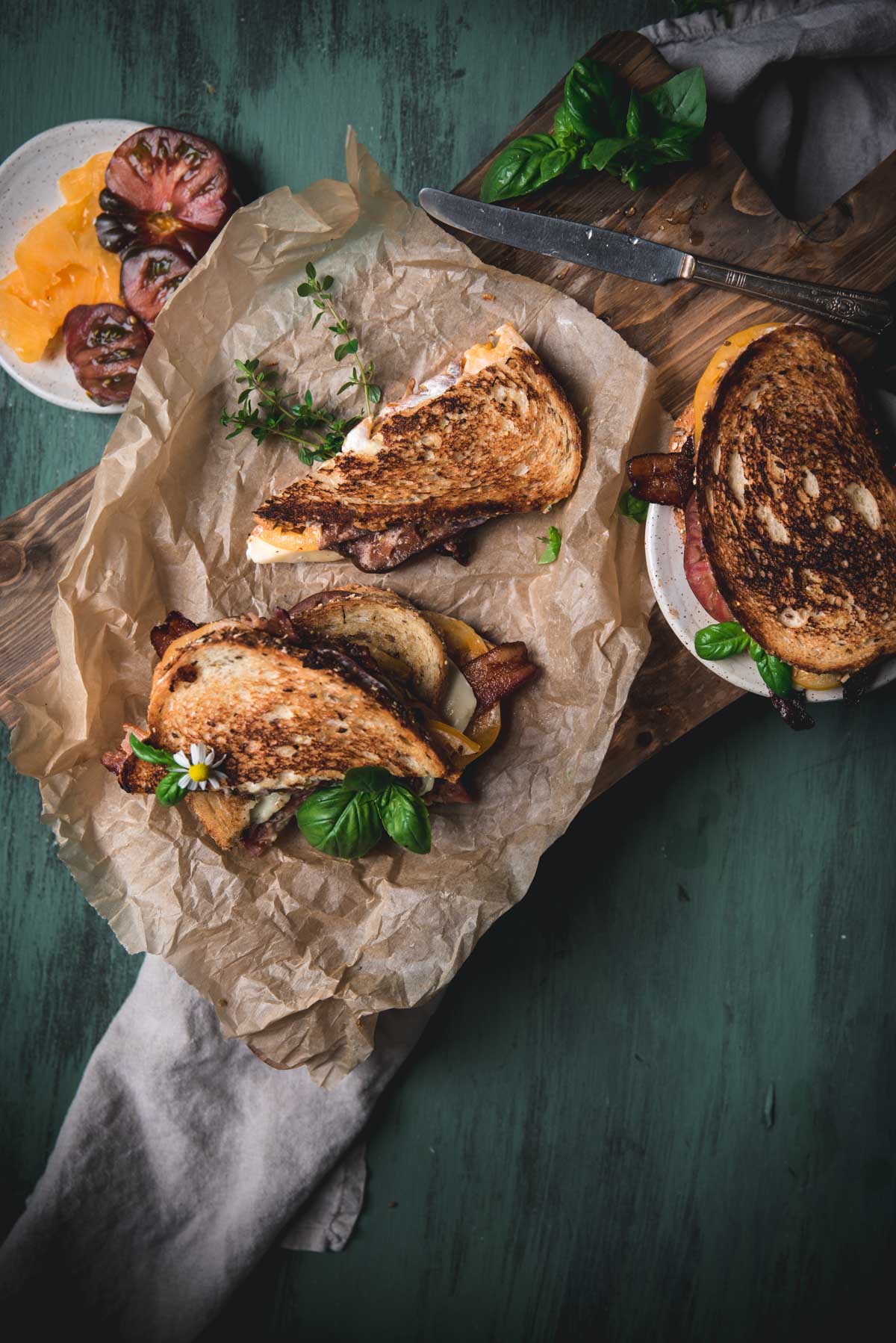 overhead image of cut triangles of bacon melt sandwich