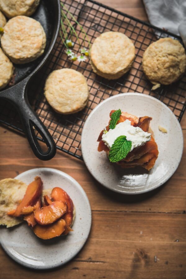making peach shortcakes with biscuits and whiskey soaked peaches