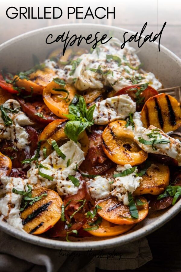 grilled peaches, sliced tomatoes and burrata in a platter bowl
