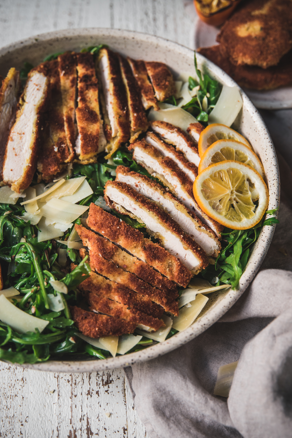 close up of sliced pieces of chicken milanese