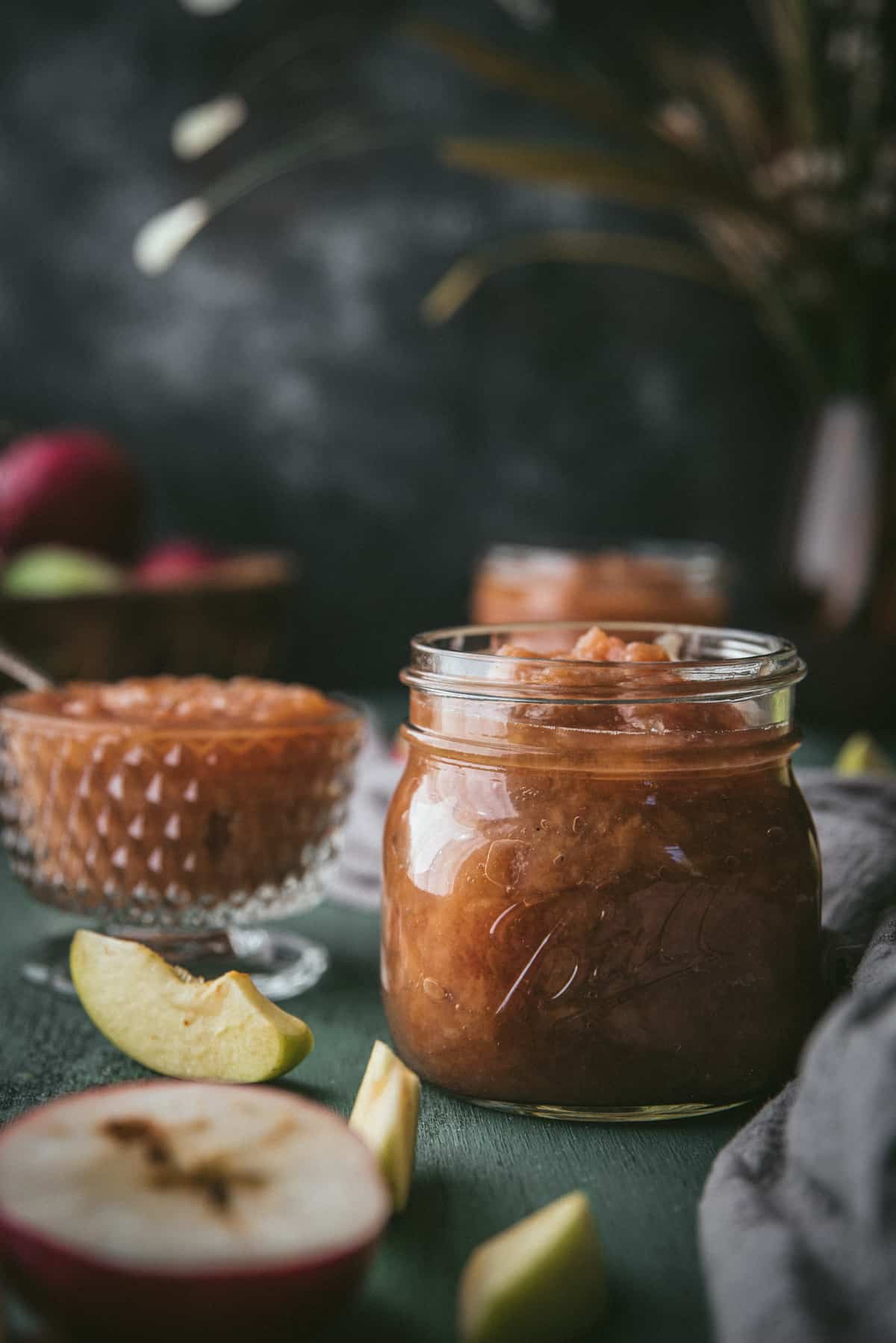 side angle of apple sauce stored in mason jars