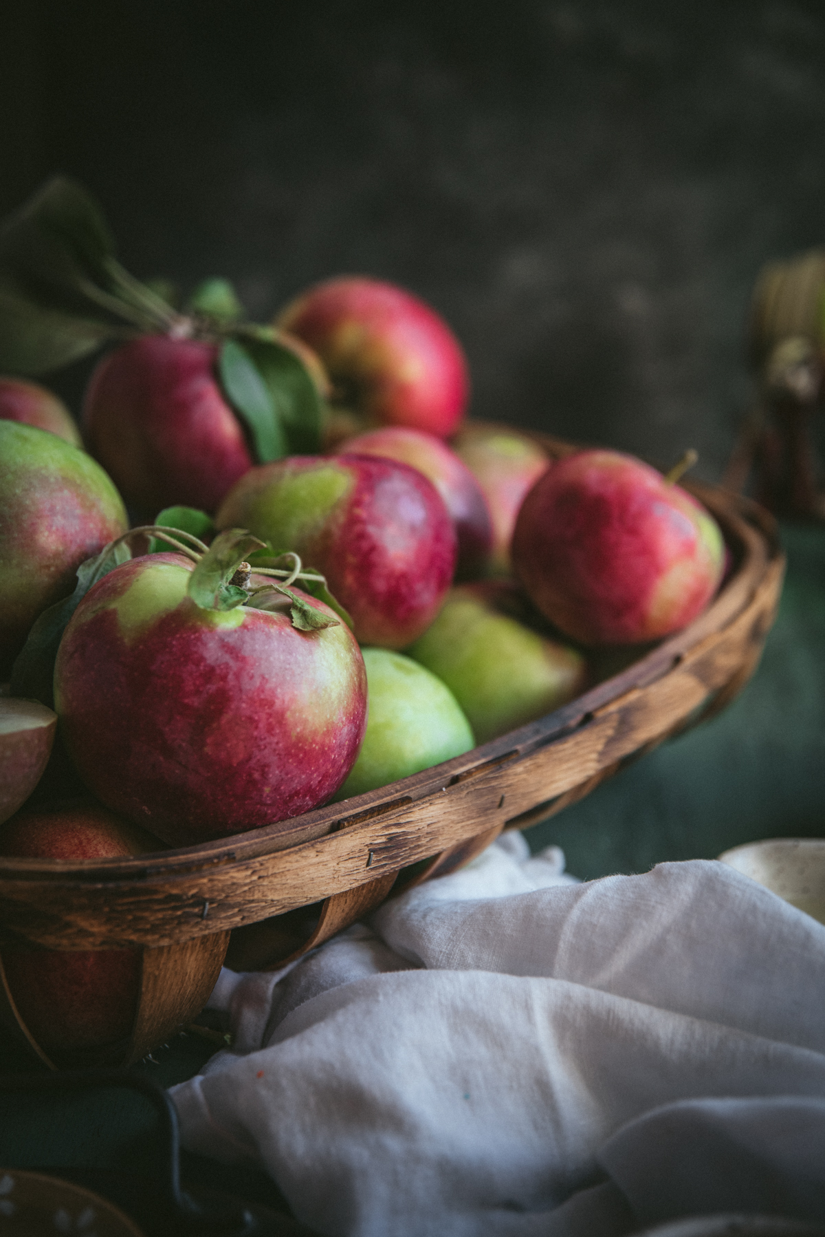 apples stacked in a basket