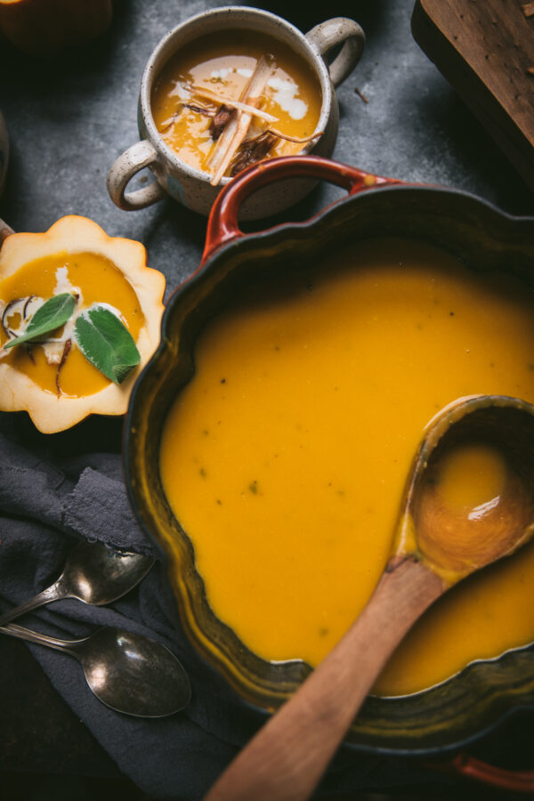 smooth squash soup in a cast iron pan