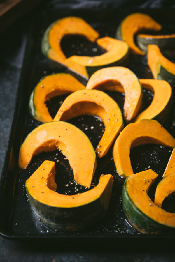 slices of kabocha squash on a sheet pan