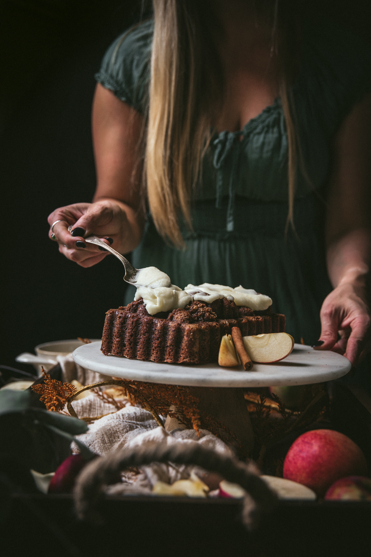 spreading icing on apple bread