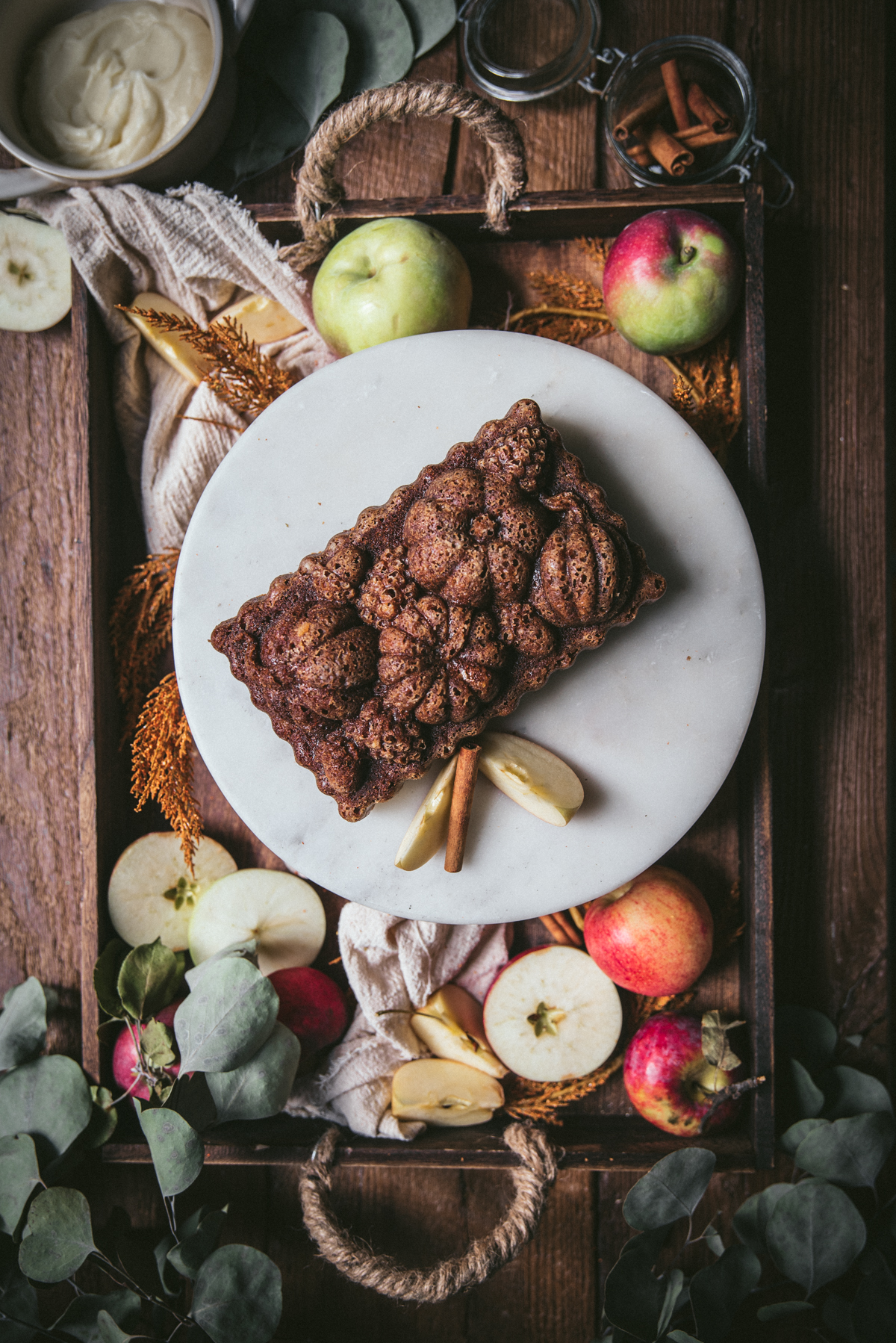 overhead of apple loaf on a cake stand