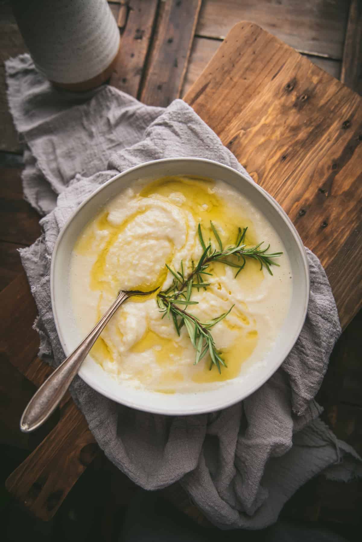 overhead of pureed parsnips with rosemary oil on top