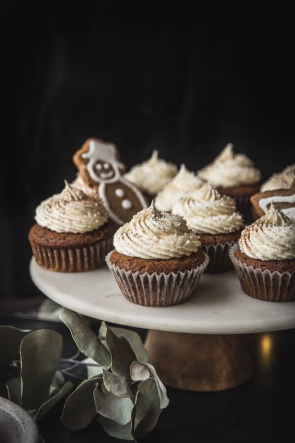 close up of gingerbread cupcakes on a cake stand