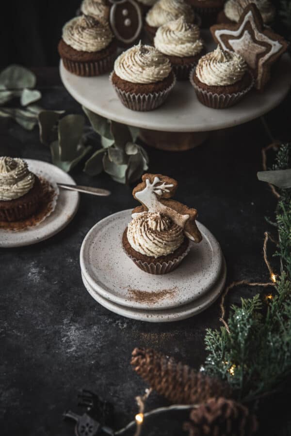 reindeer shaped cookie topping cupcake on a plate