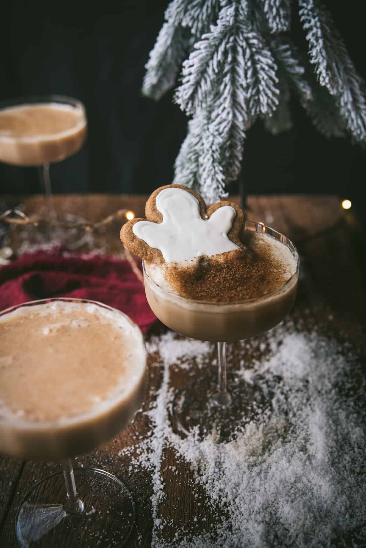 gingerbread man sitting in a martini glass