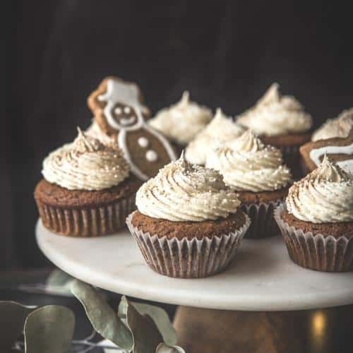 close up of gingerbread cupcakes on a cake stand