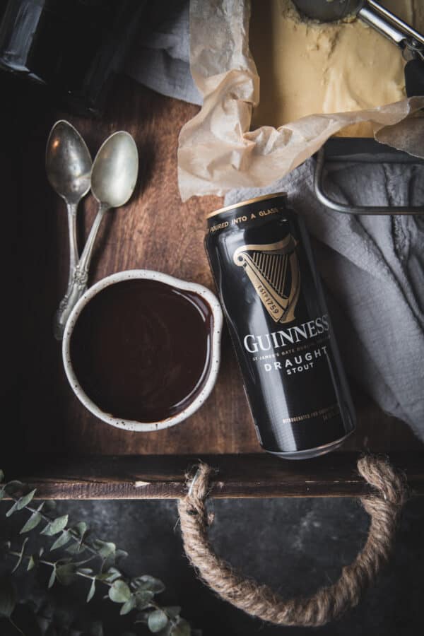 bowl of chocolate sauce and a can of guinness