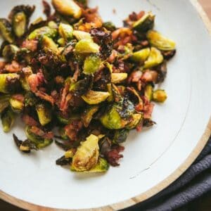 overhead of roasted brussels sprouts on a white platter