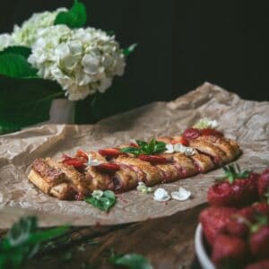 puff pastry braid on a crumpled piece of parchment paper