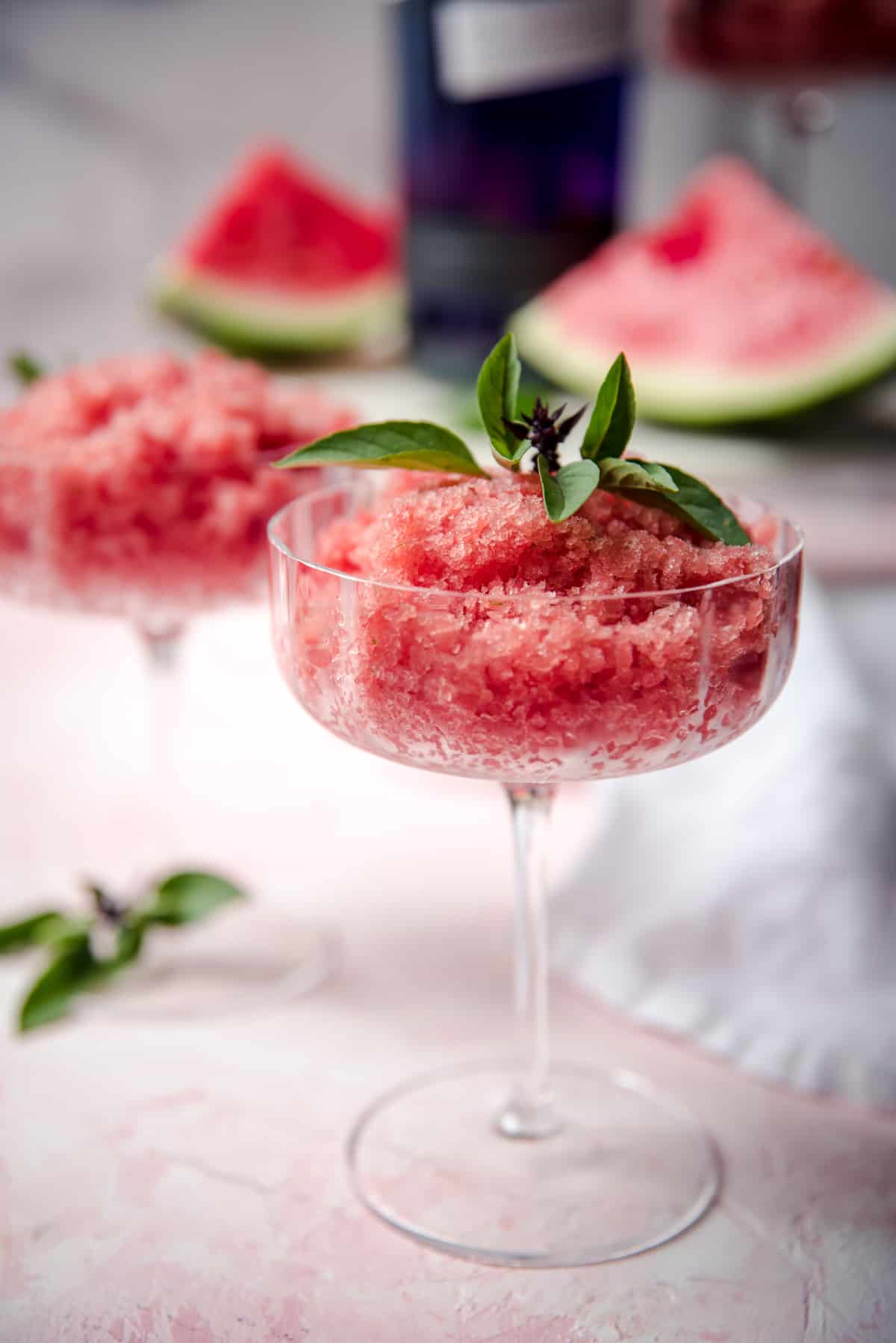 watermelon granita scooped into martini coupe glasses