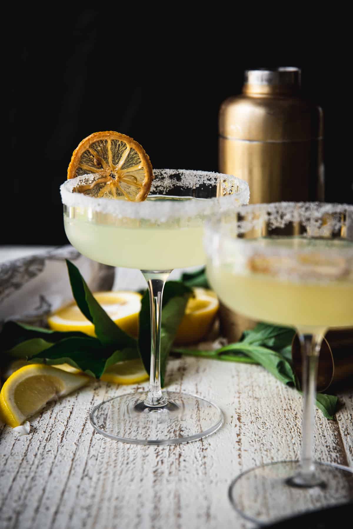 up close photo of lemon martini with a sugared lemon wheel