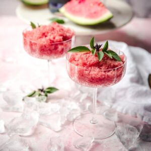 watermelon granita scooped into martini coupe glasses