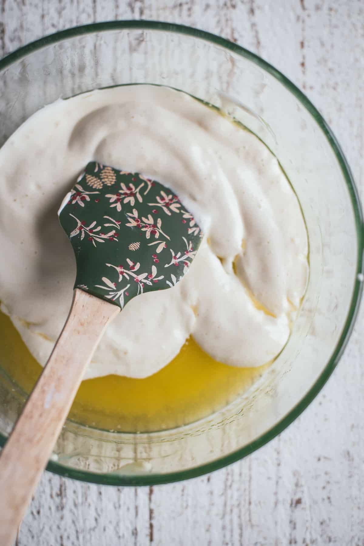 melted butter and egg based batter in a small mixing bowl