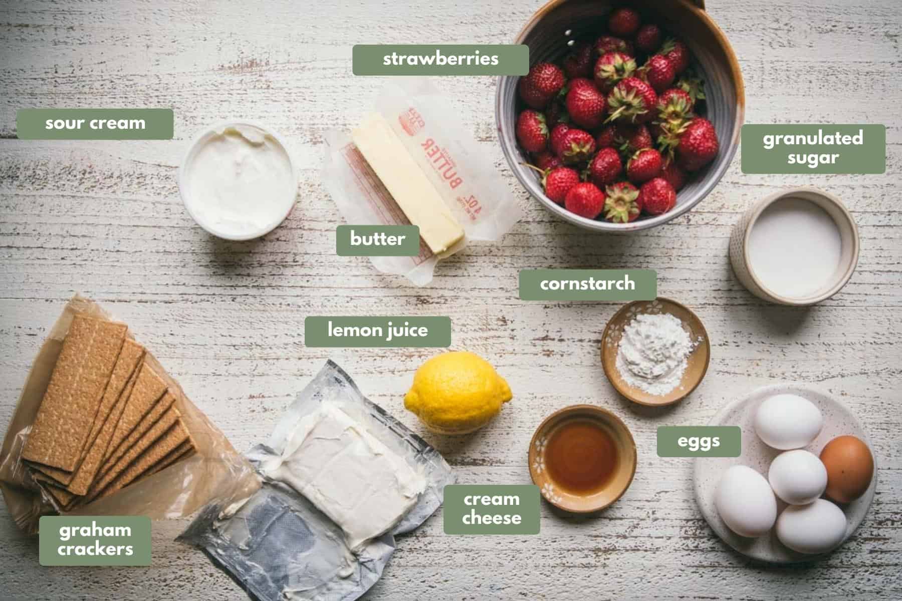 labeled ingredients for making fresh strawberry cheesecake