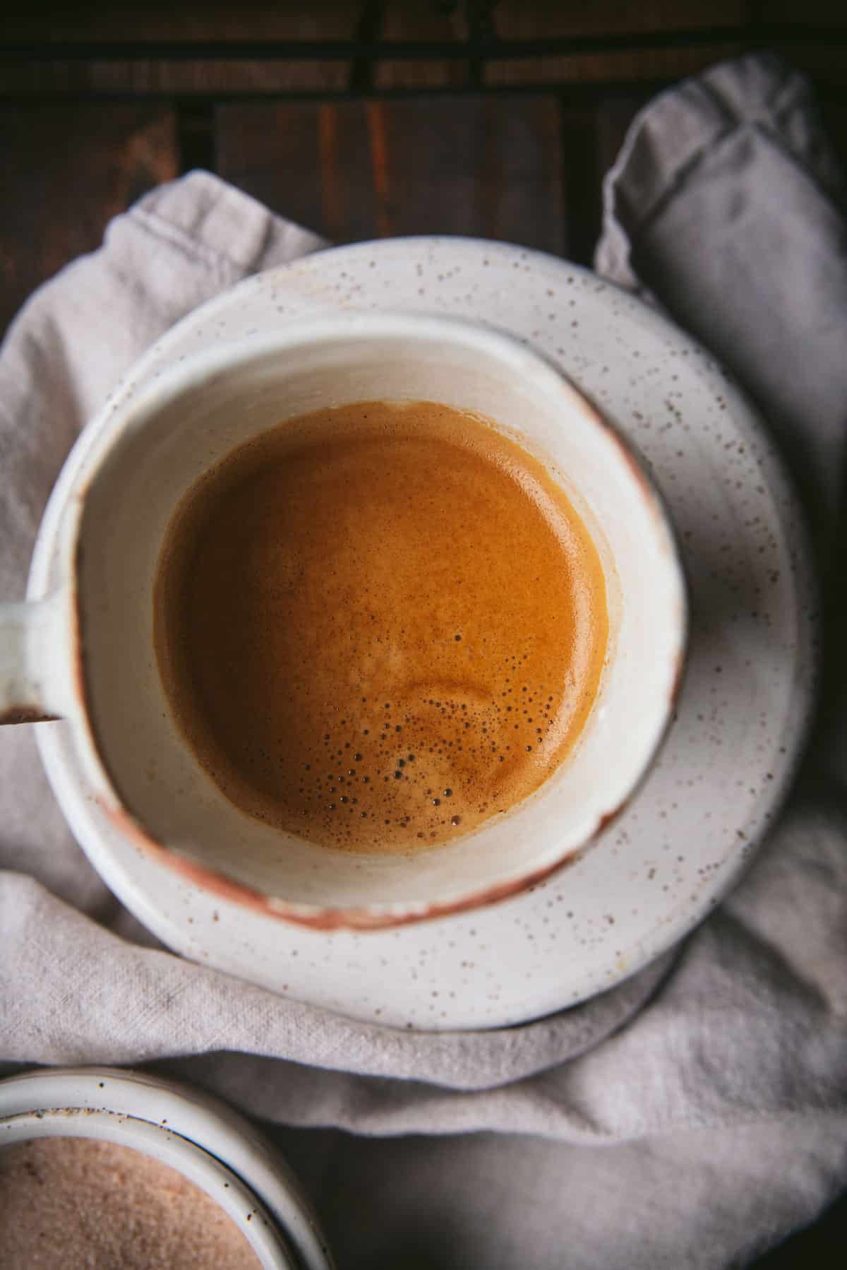 Overhead view of espresso in a ceramic mug.